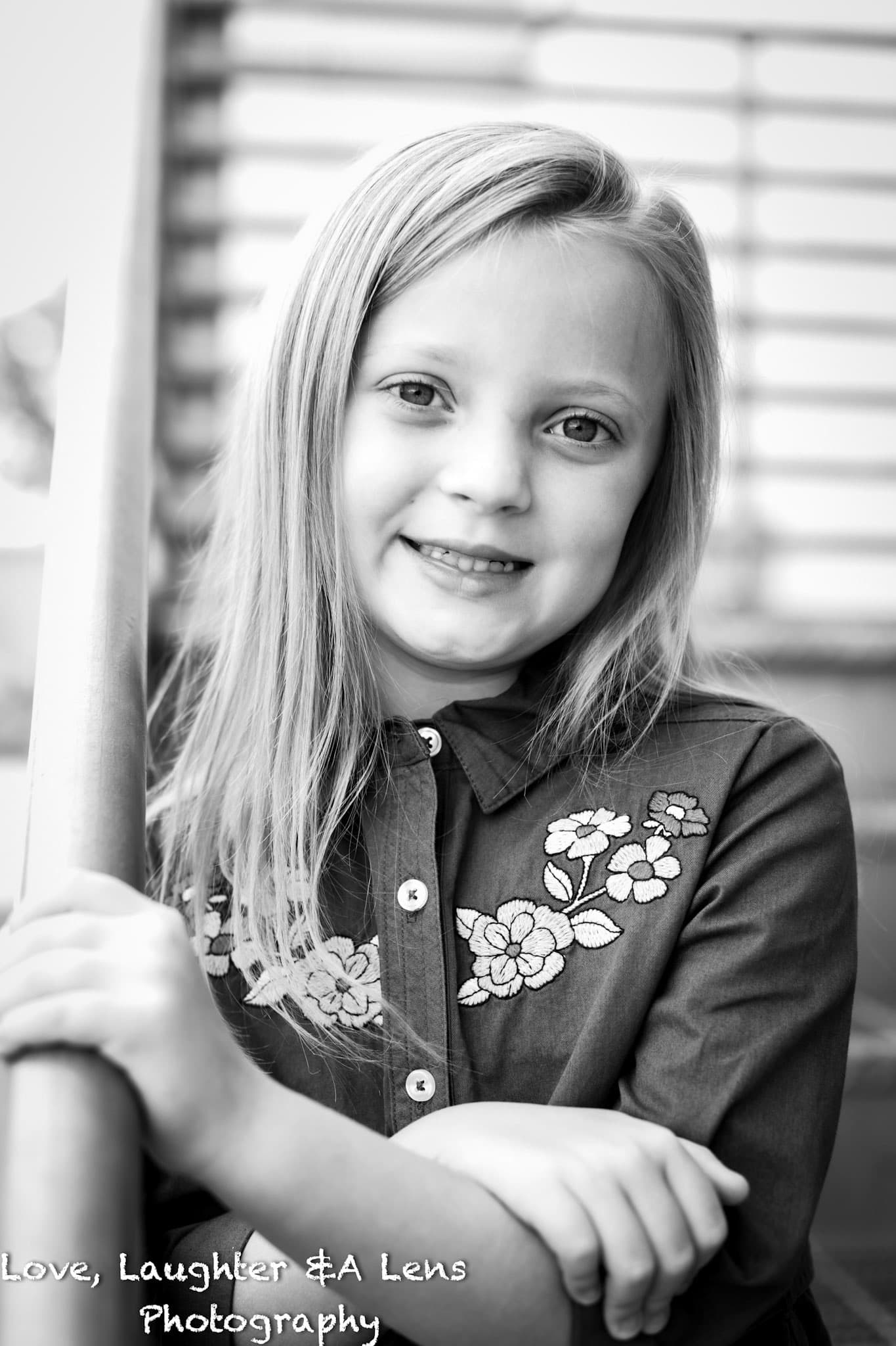 Black-and-white portrait of a smiling child