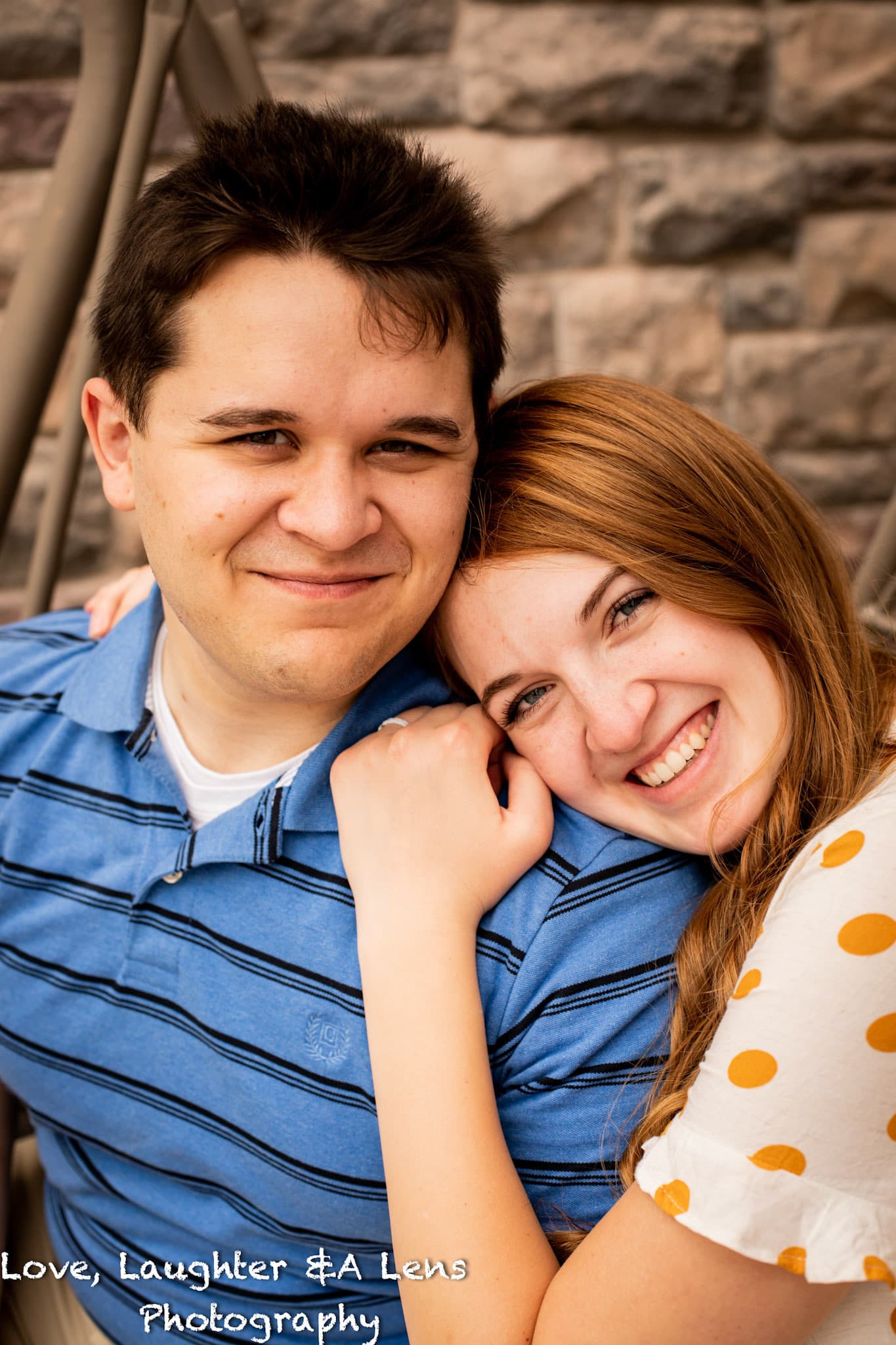 Couple smiling together on a porch swing