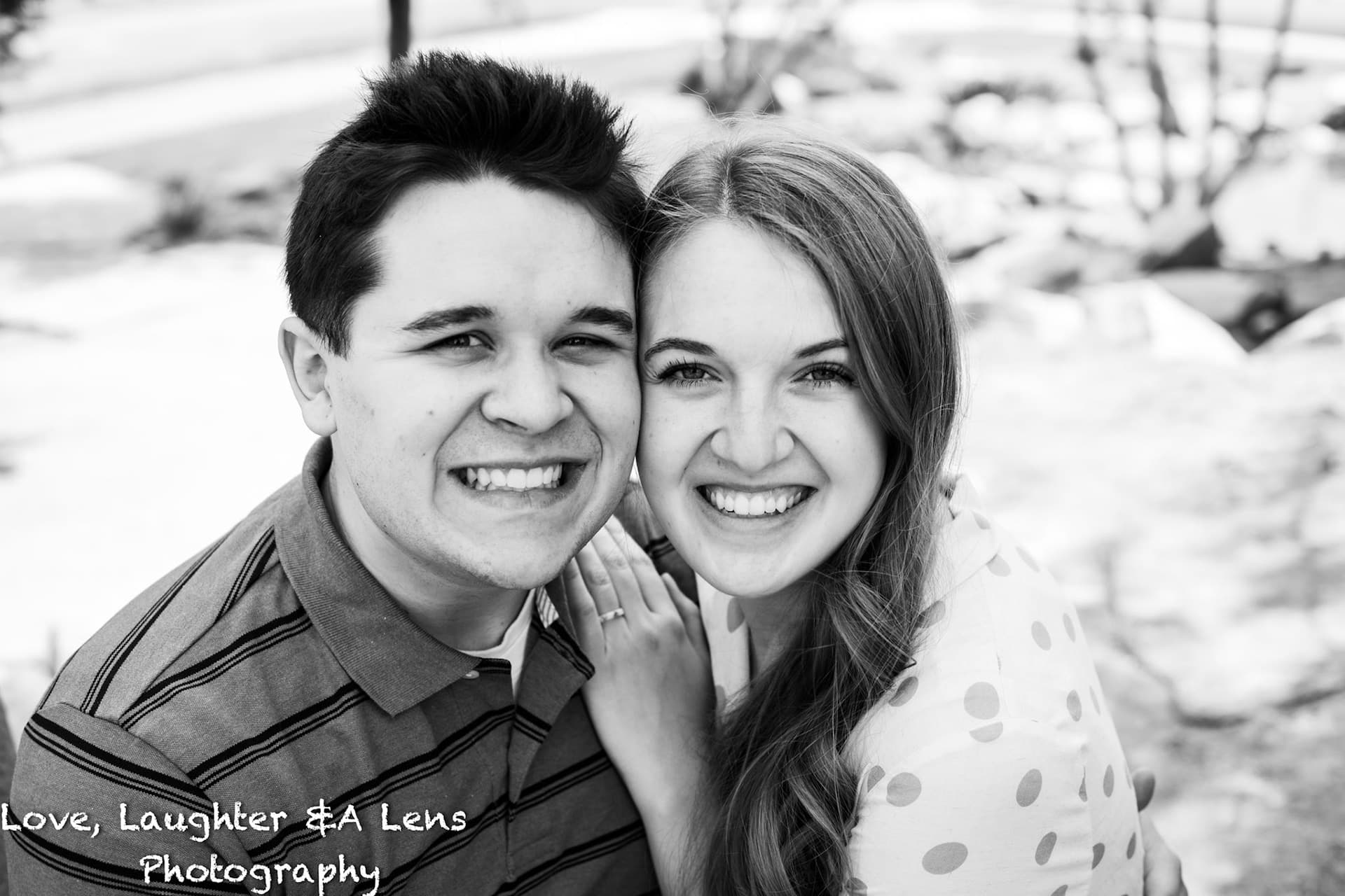 Black-and-white close-up of a smiling couple