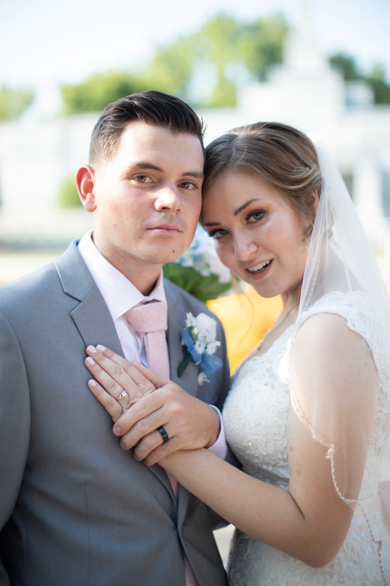 Bride and groom posing close together