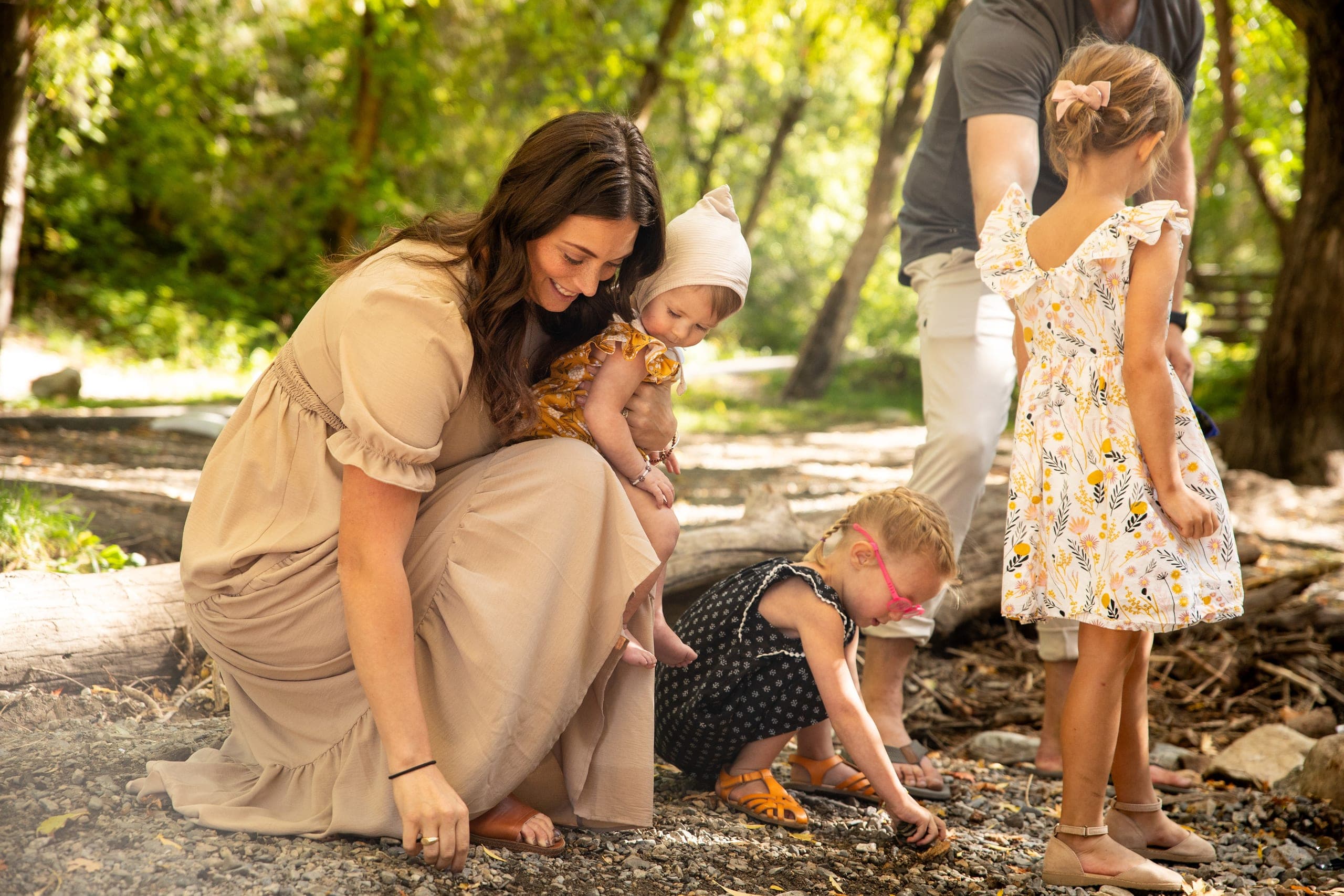 Family exploring along a creek