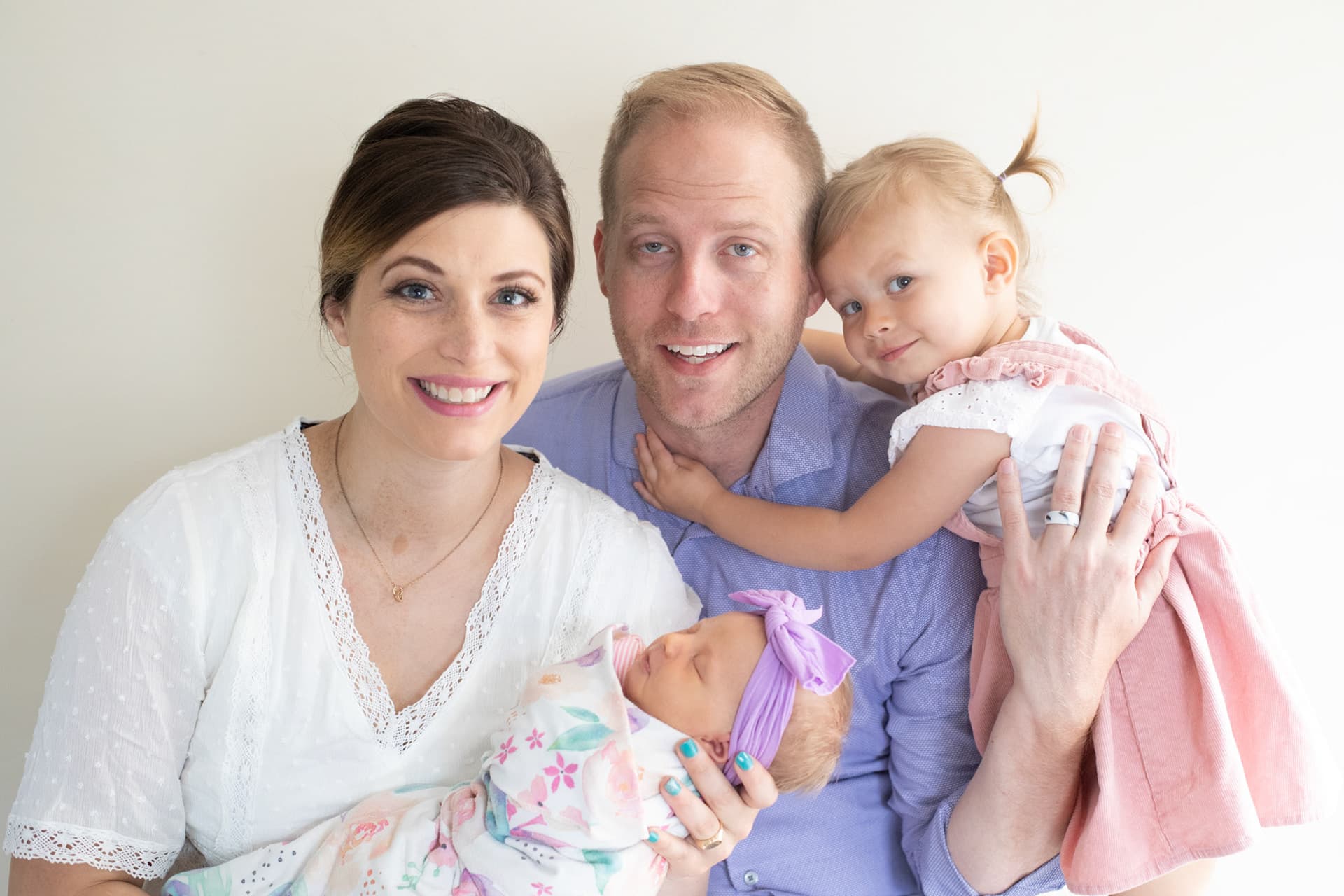 Family of four with a newborn at home