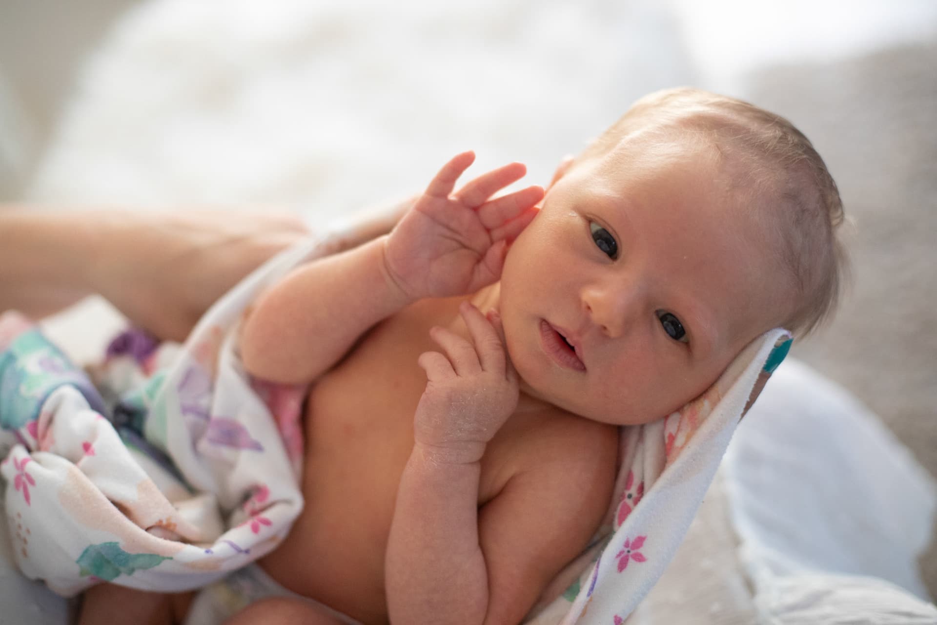 Newborn lying on a soft blanket