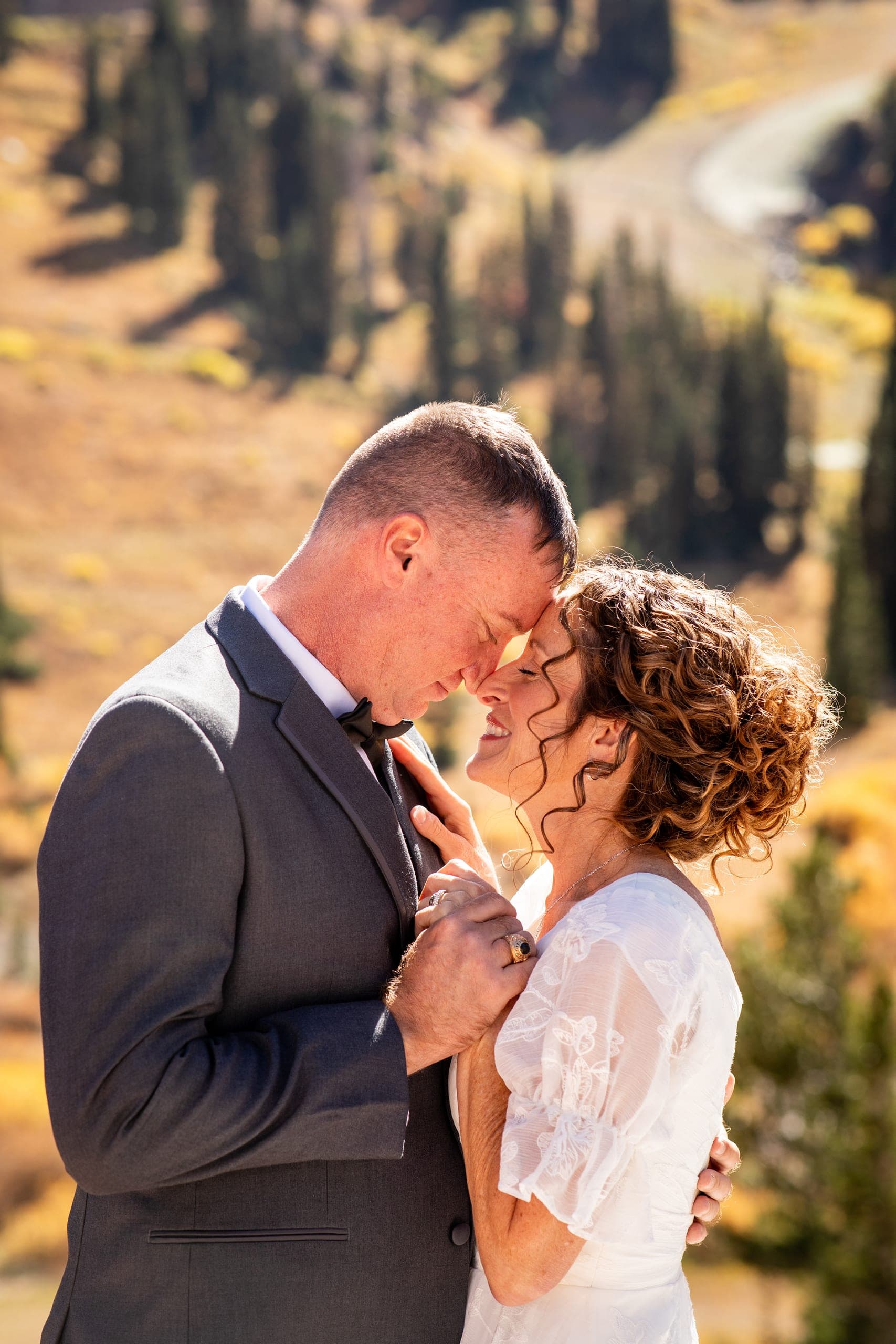 Bride and groom touching foreheads